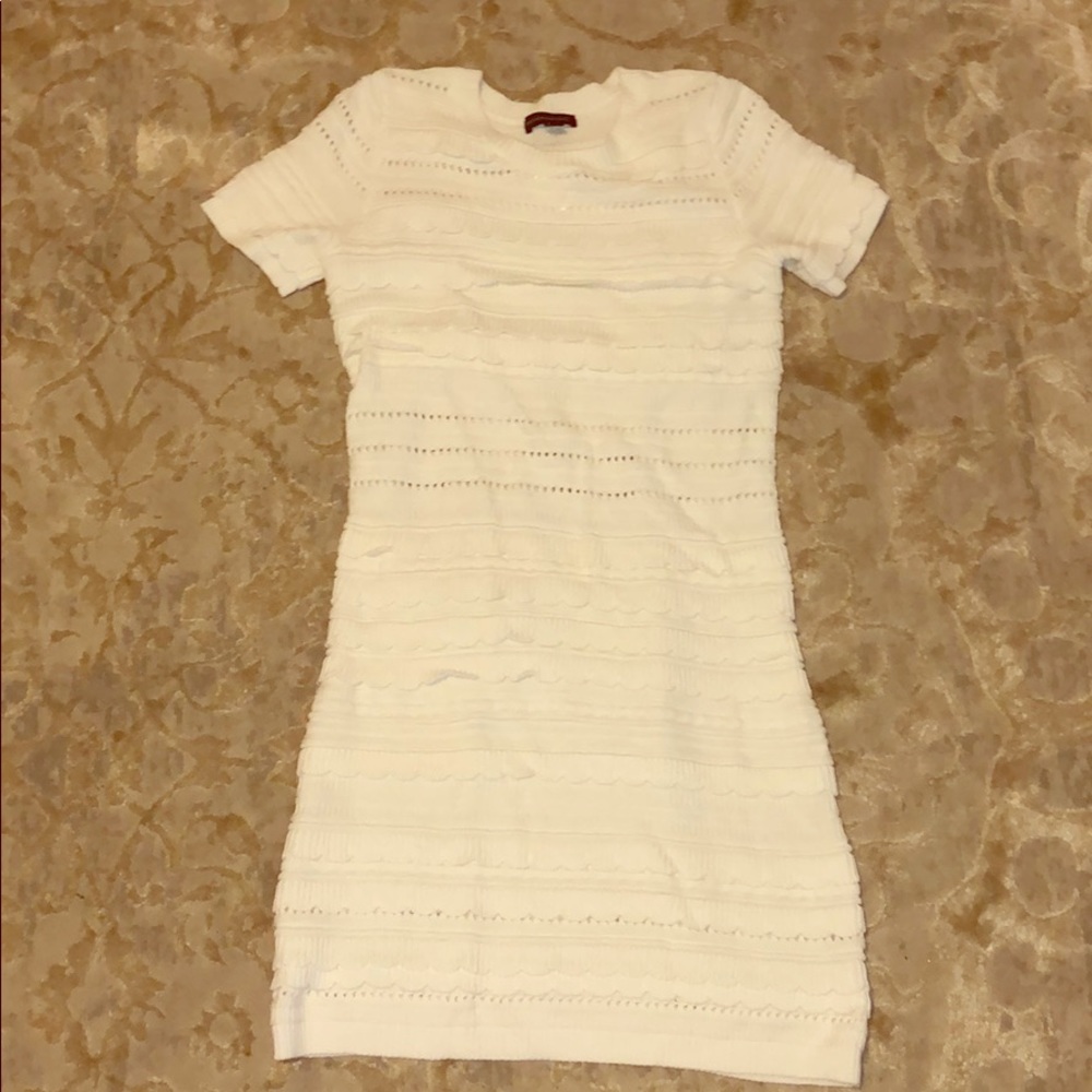 White short sleeve sweater dress. Scallop details